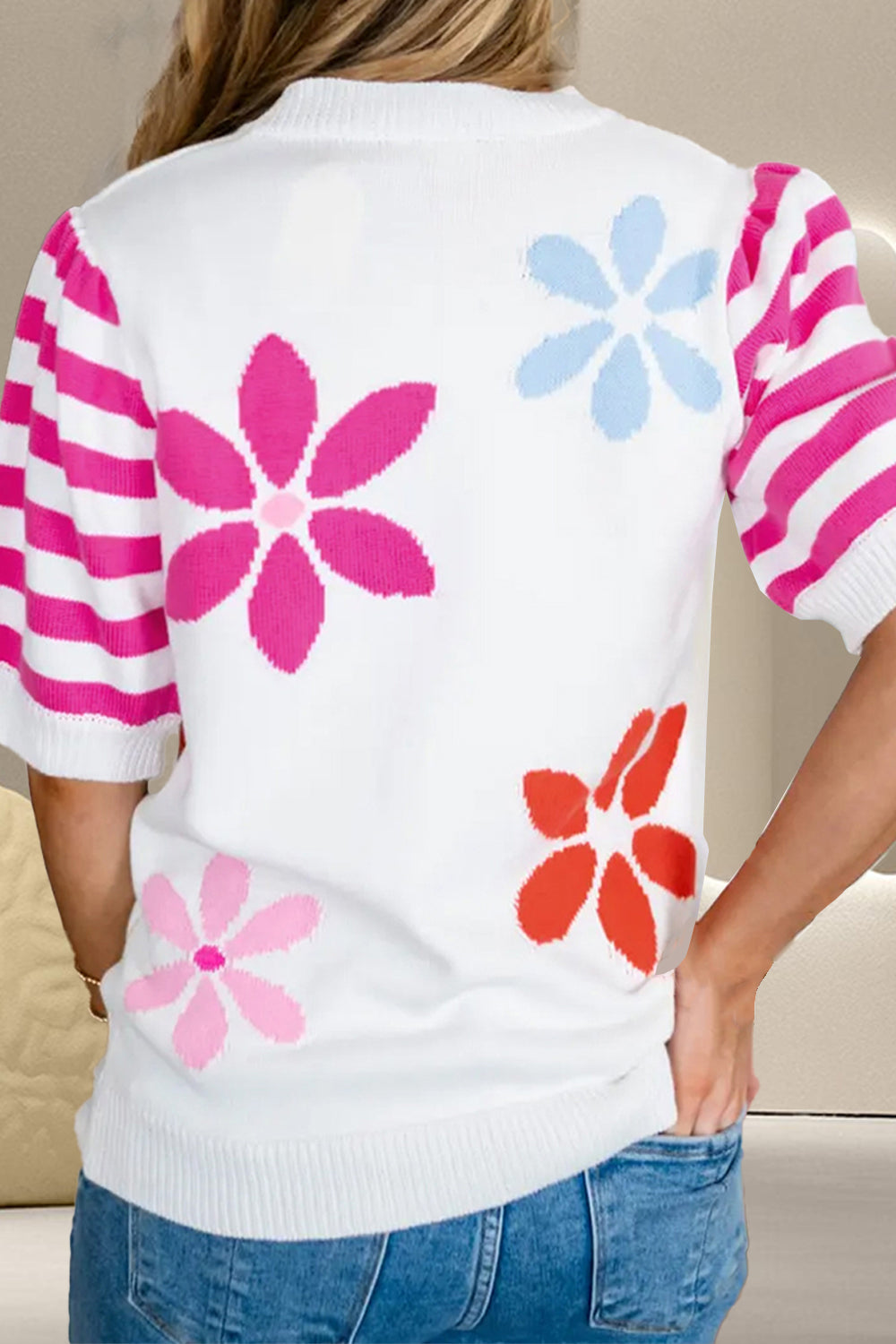 White knit top with floral print and pink striped puff sleeves