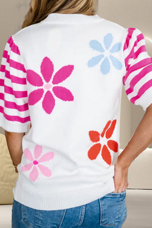 White knit top with floral print and pink striped puff sleeves