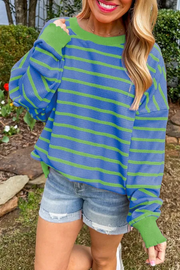 Waffle knit top with blue and green stripes, crewneck, long sleeves with contrast cuffs and lettuce trim.