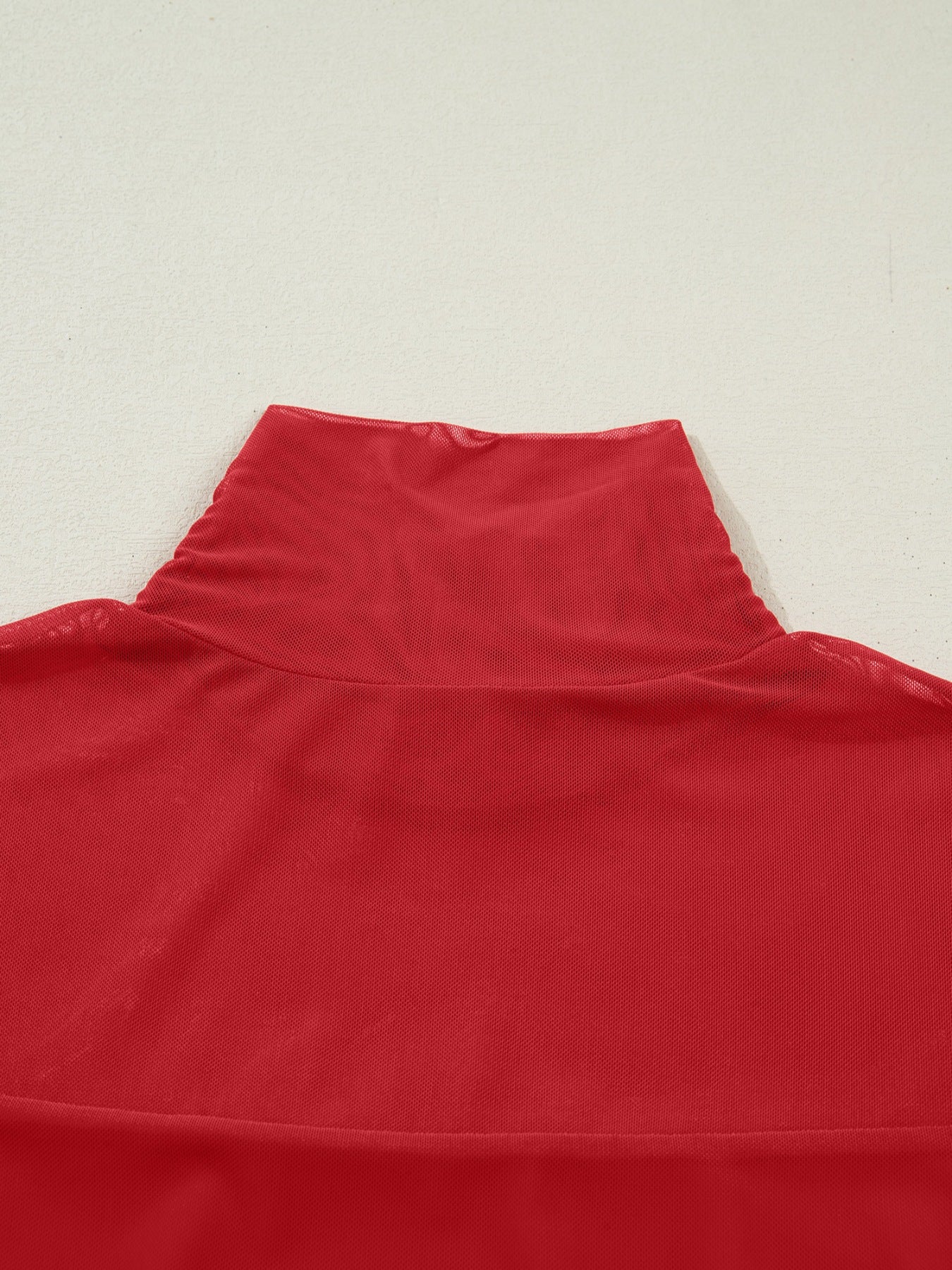 Deep red sheer mesh patchwork maternity top with high neck and long sleeves.