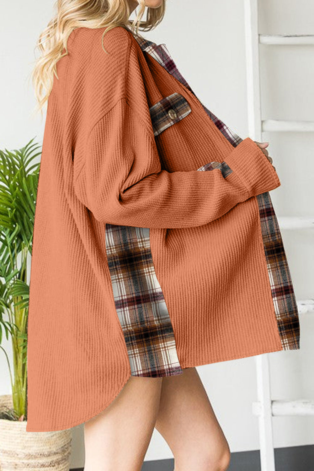 Tangerine waffle knit overshirt with plaid trim and button pocket detail.