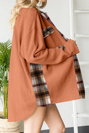 Tangerine waffle knit overshirt with plaid trim and button pocket detail.