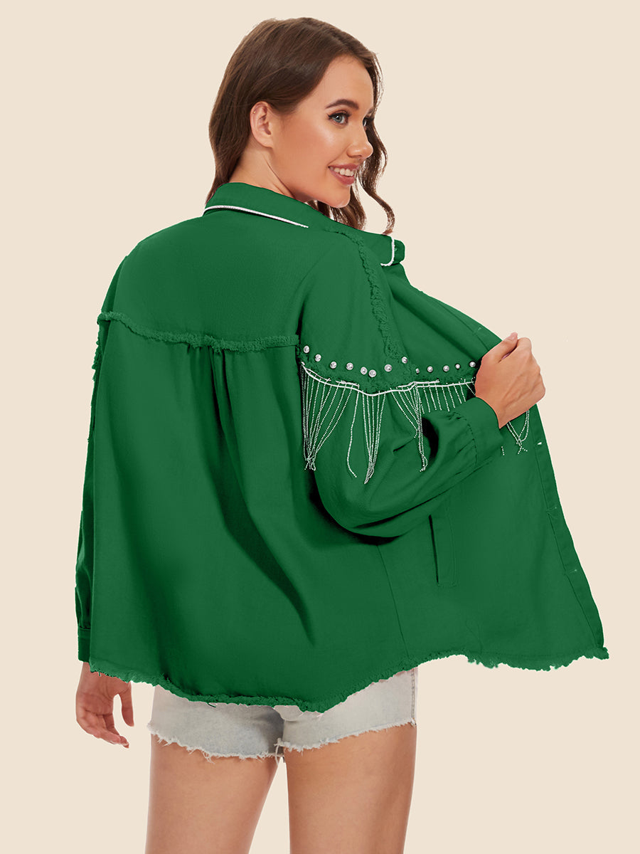 Dark green trucker jacket with fringe and pearl embellishments on the shoulders and frayed hem.