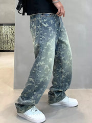 Loose-fit denim jeans with all-over bird print in vintage wash.