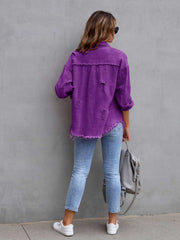 Purple distressed denim shacket with frayed hem and cuffs, styled with light wash jeans.