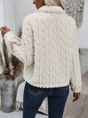 Cream textured teddy bear bolero jacket with cable knit pattern and fuzzy trim.