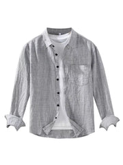 Grey linen textured long sleeve button-up shirt with chest pocket and rolled cuffs.
