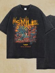 Black oversized graphic tee with "SMILE" text and abstract art print.