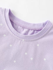Lavender cotton baby dress with white polka dots and crew neck detail.
