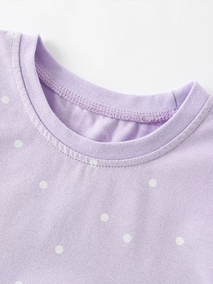 Lavender cotton baby dress with white polka dots and crew neck detail.