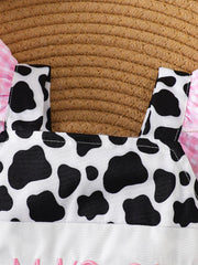 Baby one-piece with cow print bodice and pink gingham ruffled sleeves.