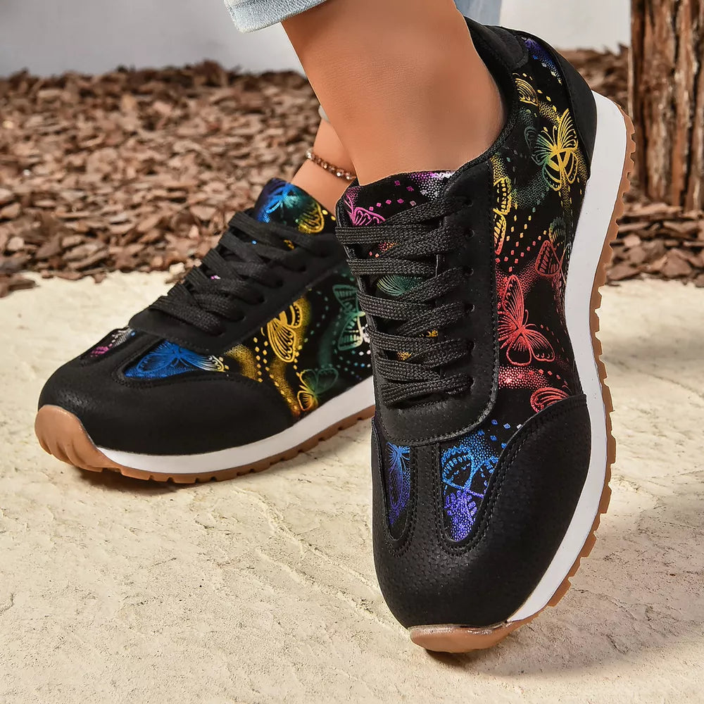 Black casual sneakers with rainbow butterfly print and lace-up closure.