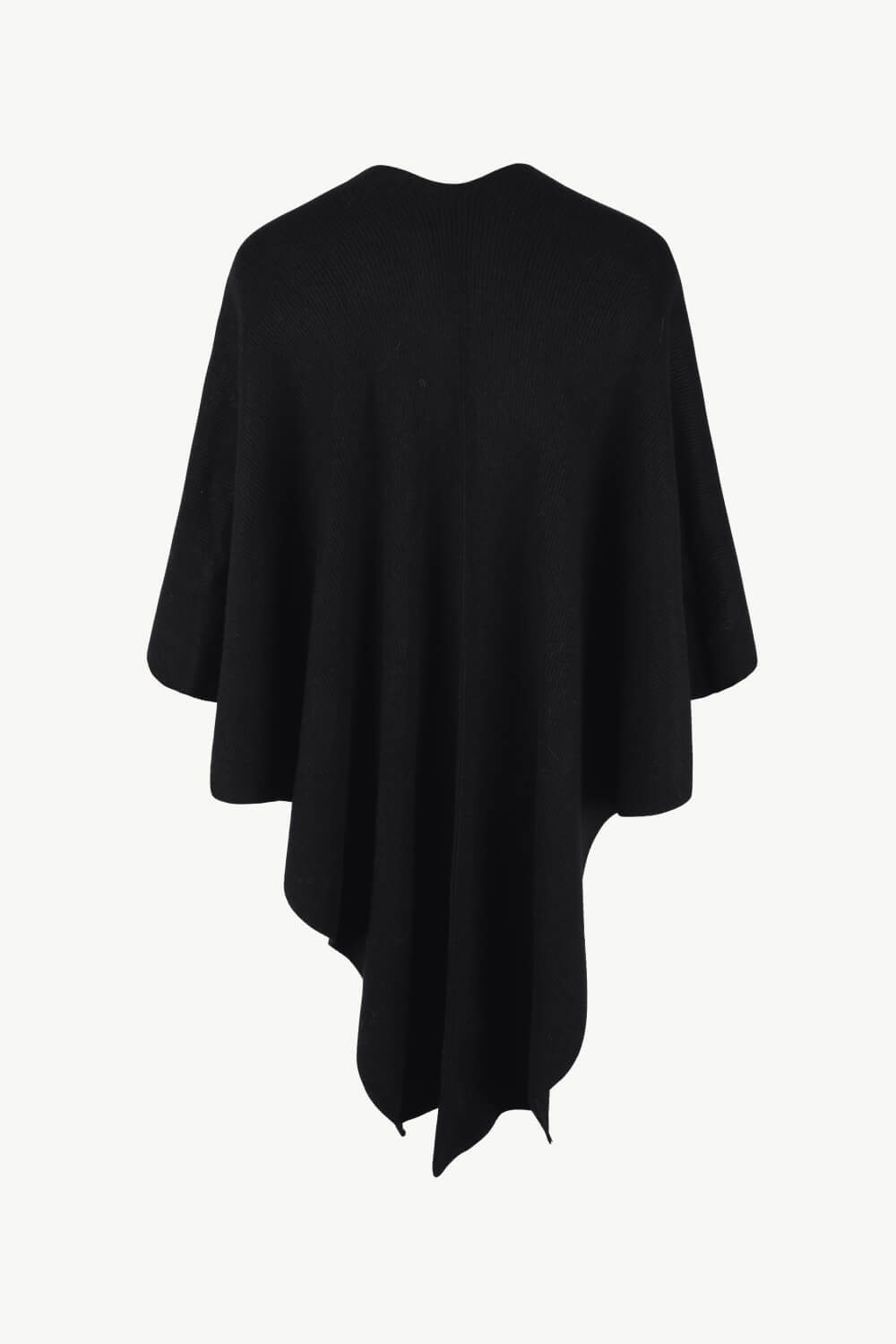 Black knit cape with draped asymmetrical hem and subtle fur trim detail.