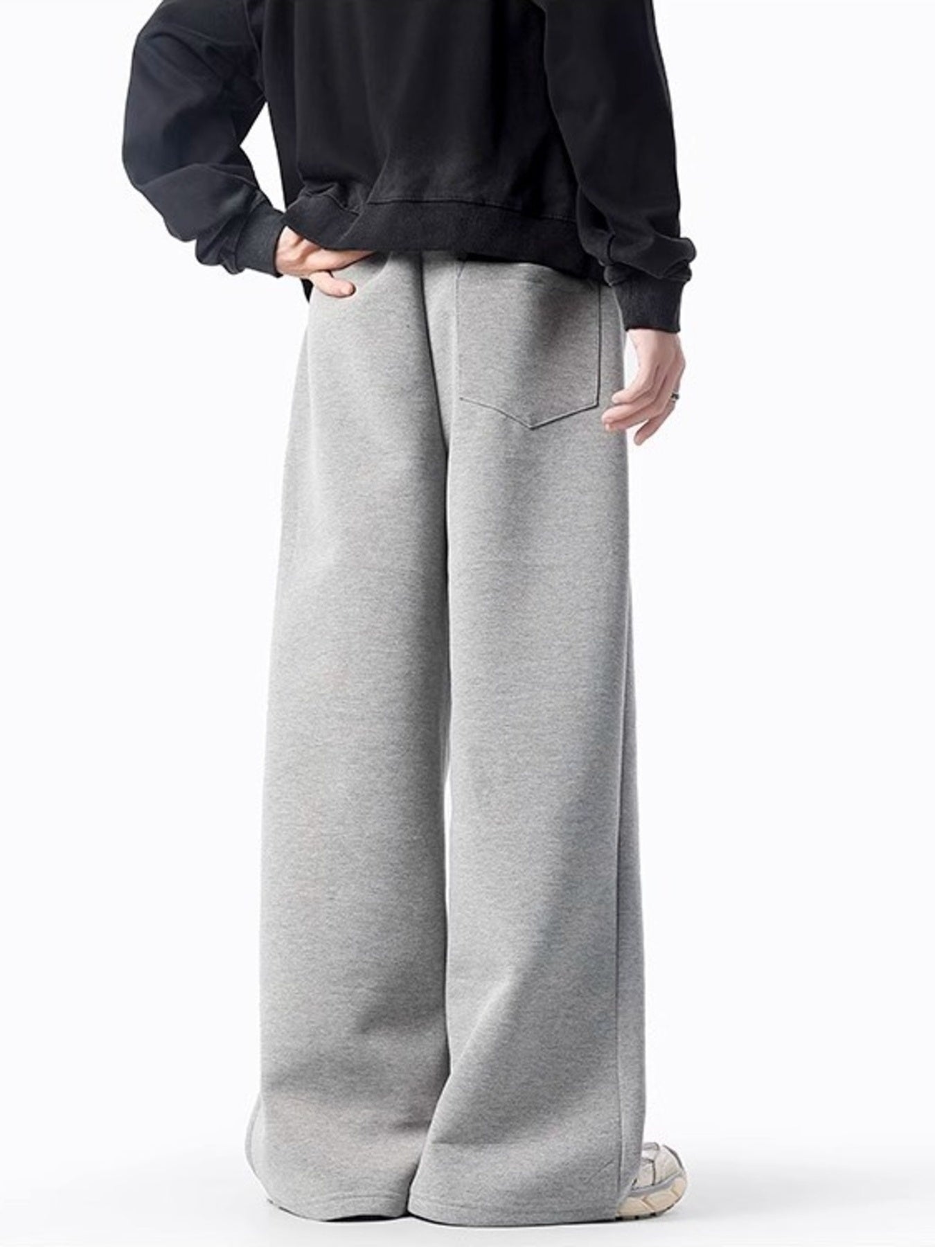 Men's gray casual wide-leg sweatpants with back pocket and drawstring detail.