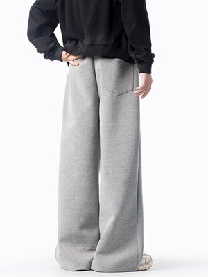 Men's gray casual wide-leg sweatpants with back pocket and drawstring detail.