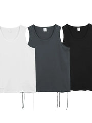 Three Vonili raw edge scoop neck tank tops in ivory, dark gray, and black with drawstring detail.