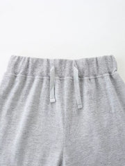 Grey cotton blend baby shorts with elastic waistband and drawstring.