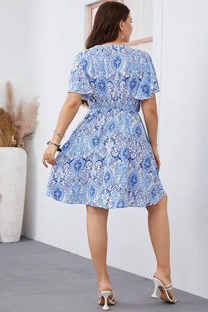 Pastel blue medallion print mini dress with flutter sleeves and a cinched waist.