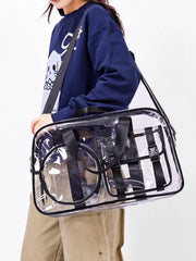 Chic clear PVC travel bag with pink accents and adjustable strap.