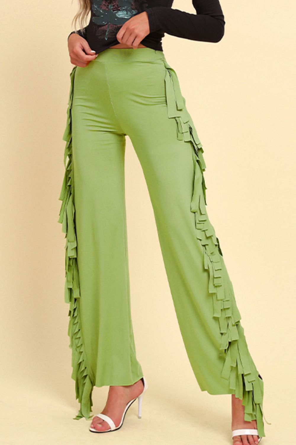 Yellow-green palazzo trousers with cascading fringe detail on the sides.