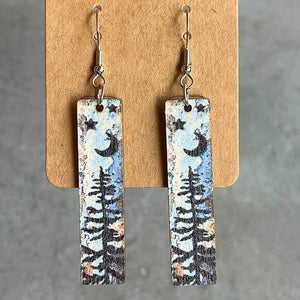 Painted landscape dangle earrings with moon, stars, and trees.