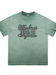 Green vintage wash graphic tee for men with crew neck and script text design.