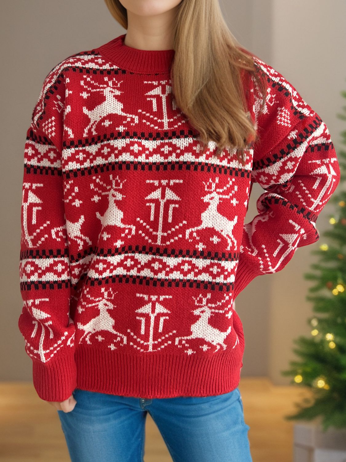 Reindeer Fair Isle crew neck sweater in deep red acrylic with white reindeer and geometric patterns.