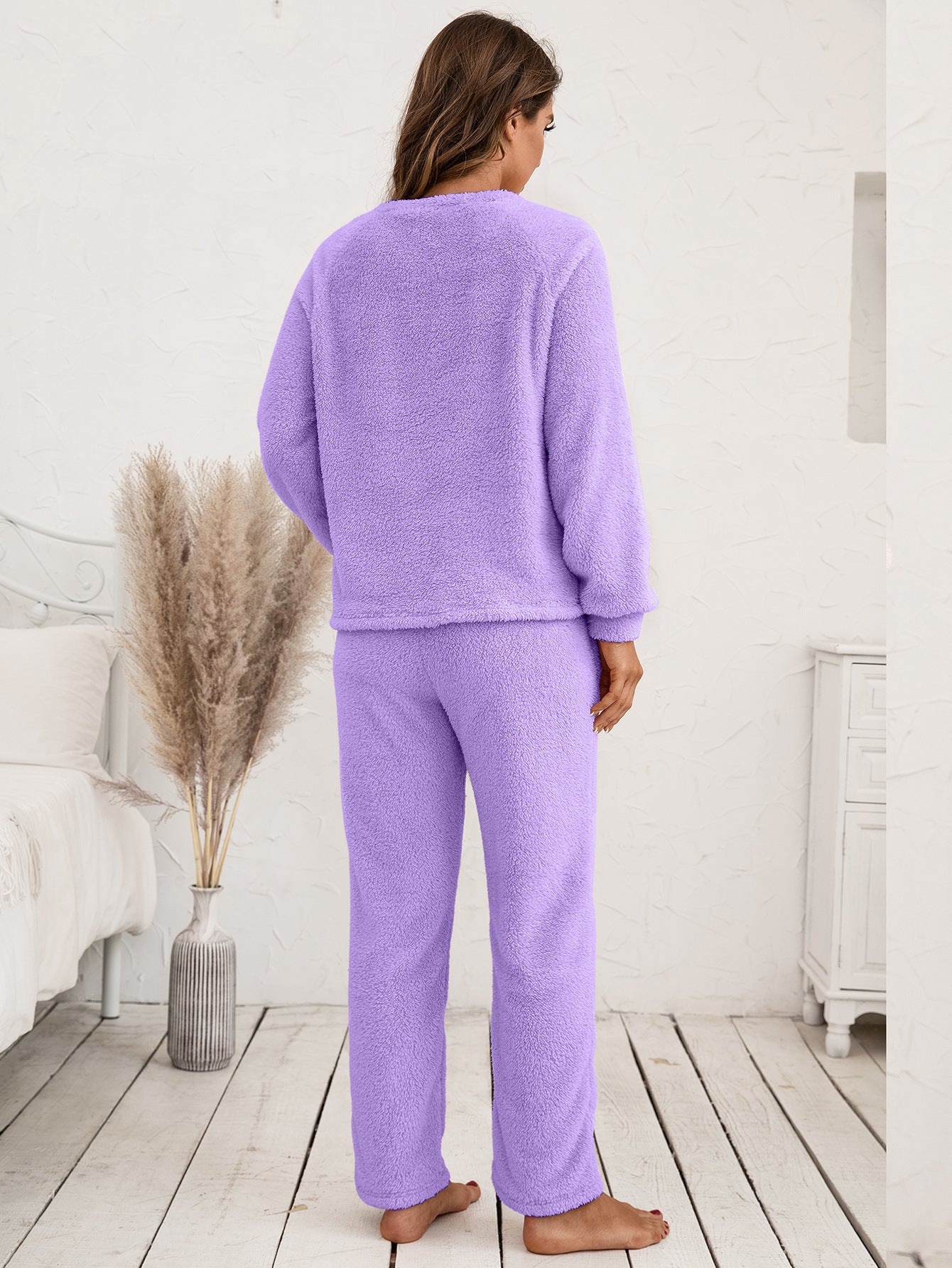 Plush loungewear set in lavender with raglan sleeves and relaxed fit pants.