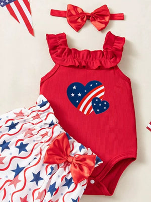 Red patriotic baby set with ruffled neckline, heart print bodysuit, star print bloomer shorts, and bow headband.