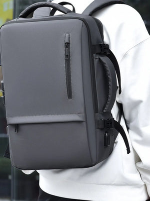 Dark gray convertible commuter backpack with multiple zippered pockets and a side USB port.