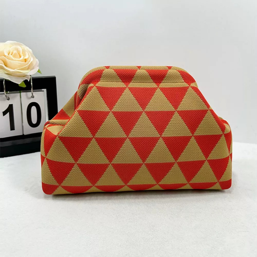 Vibrant knit clutch bag with striking red and tan triangle pattern