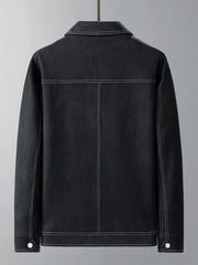 Black trucker jacket with contrast stitching and snap cuff