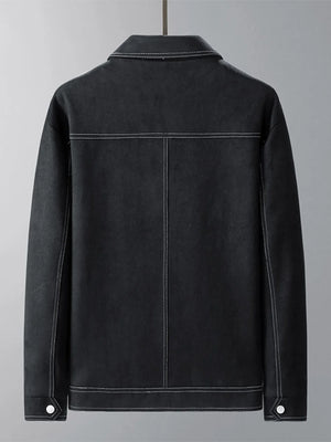 Black trucker jacket with contrast stitching and snap cuff