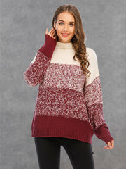 Colorblock knit turtleneck sweater in cream and wine with defined panels and textured acrylic yarn.