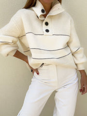 Cream waffle knit button-up collar sweater with navy stripes and button details.