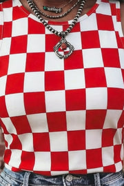 Red and white checkered fitted tank top with crew neck, styled with layered necklaces.