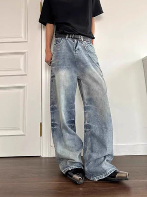 Men's wide leg jeans in light blue wash denim with a relaxed fit and chain detail.