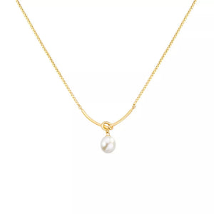 Gold necklace with a curved bar and a single pearl pendant.