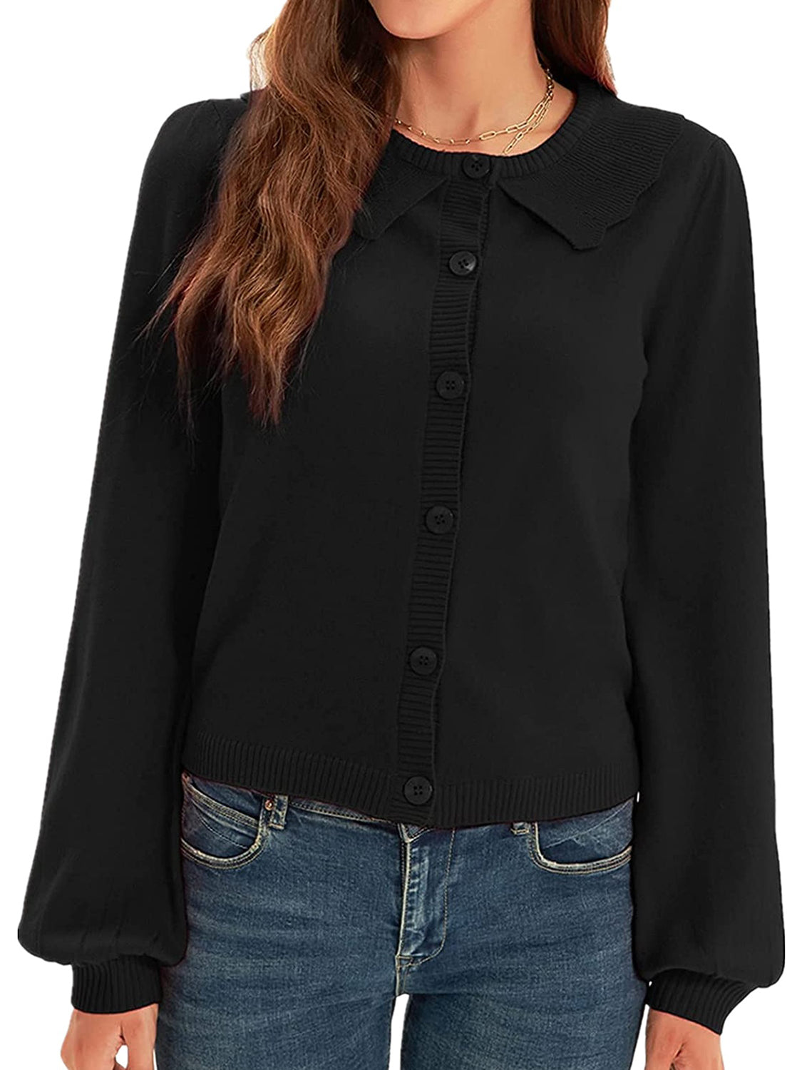 Black knit cardigan with scalloped collar, button front, and balloon sleeves.