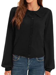 Black knit cardigan with scalloped collar, button front, and balloon sleeves.