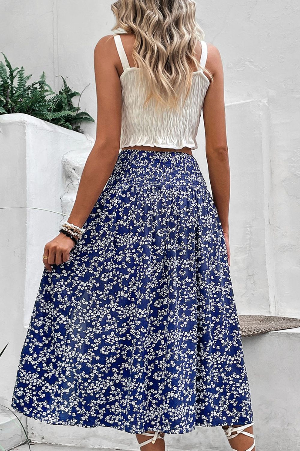 Ditsy floral midi skirt in blue with a slit, flowy A-line cut.