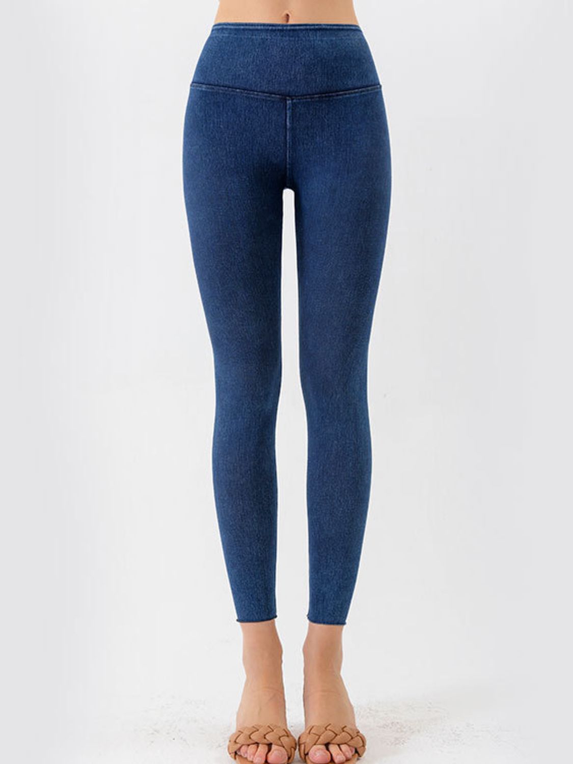 Sculpted denim leggings in peacock blue with a V-waist and seamless ankles.