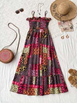 Frilled smocked leopard maxi dress with patchwork animal print, spaghetti straps, and tiered skirt.