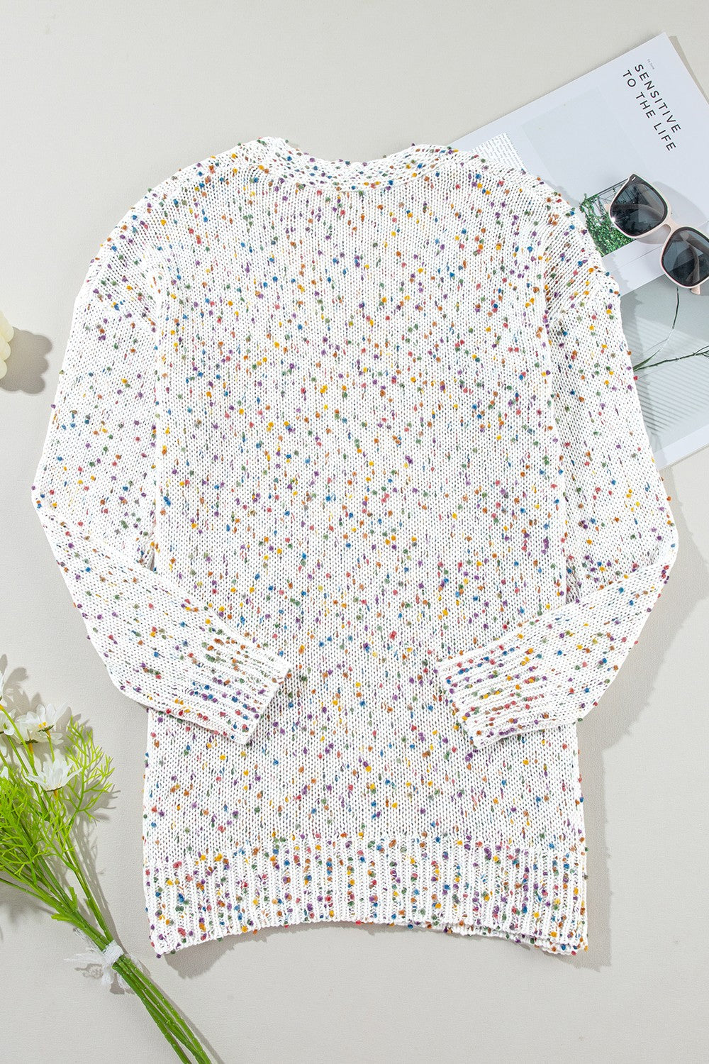Confetti knit open-front cardigan in ivory with colorful speckles.