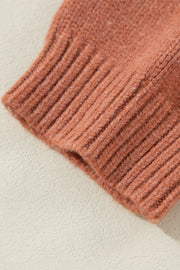 Open-front cropped knit cardigan in burnt coral acrylic with ribbed detail.