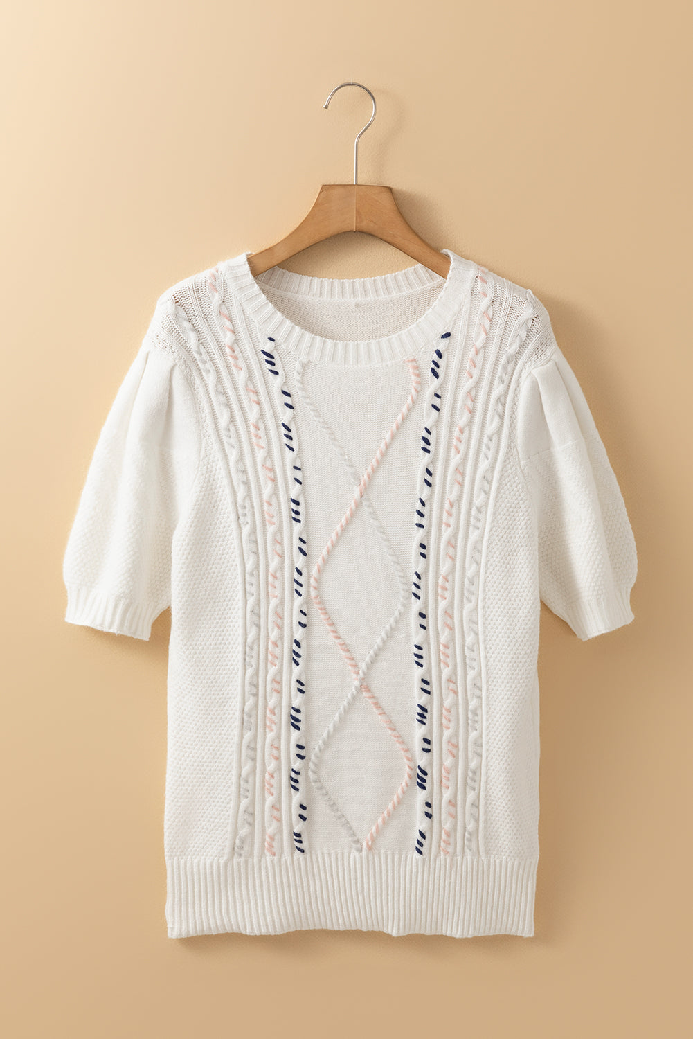 White cable knit sweater with puff sleeves and diamond stitch detail
