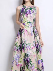 Sleeveless midi dress in blush pink with a wisteria floral print and A-line skirt.