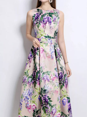 Sleeveless midi dress in blush pink with a wisteria floral print and A-line skirt.