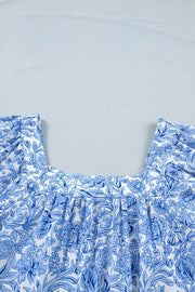 Floral pleated blouse with square neckline in blue and white polyester