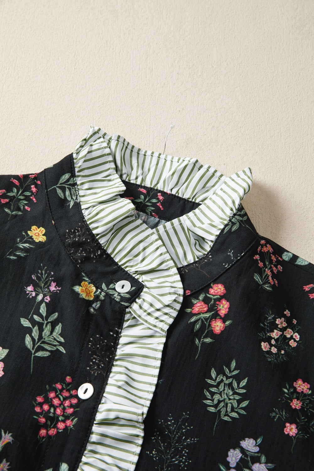 Black floral cotton blouse with ruffled striped collar and button front